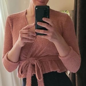 Pink sweater top. Long ties that wrap around. Size small. Fits small/medium.